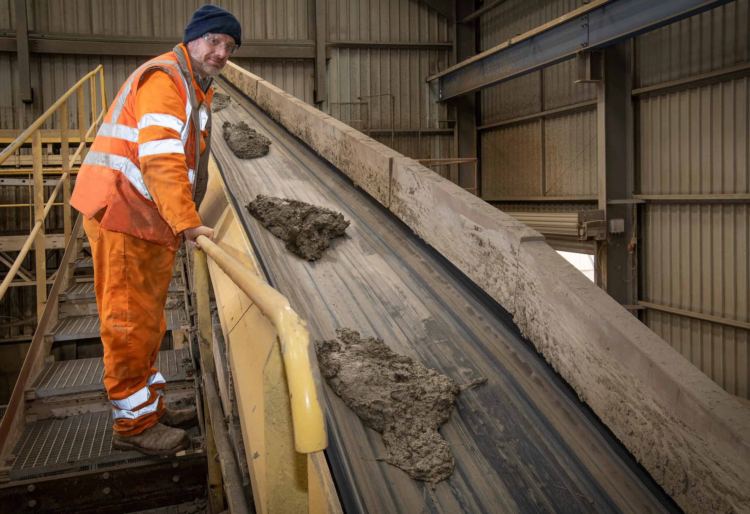 man overseeing manufacturing process